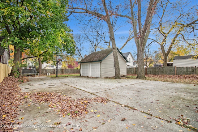 exterior space featuring an outbuilding and a garage