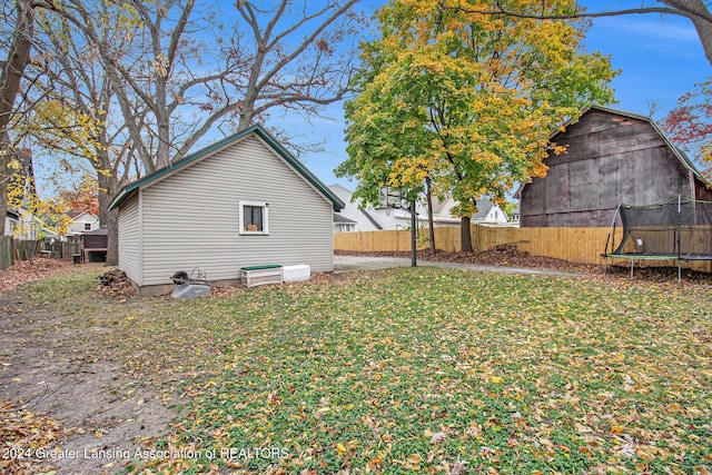 223 S Pennsylvania Ave, Lansing, MI 48912 - view of yard with a trampoline