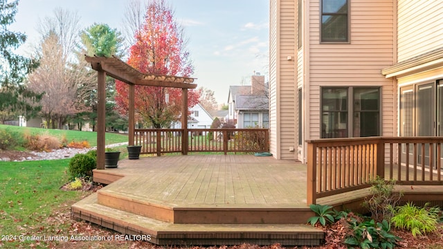 deck with a yard and a pergola