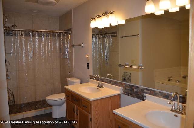 full bathroom with plus walk in shower, tile patterned floors, toilet, decorative backsplash, and vanity