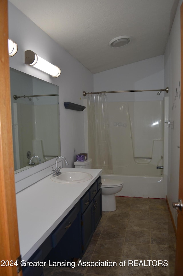 full bathroom featuring vanity, toilet, and shower / bath combo with shower curtain