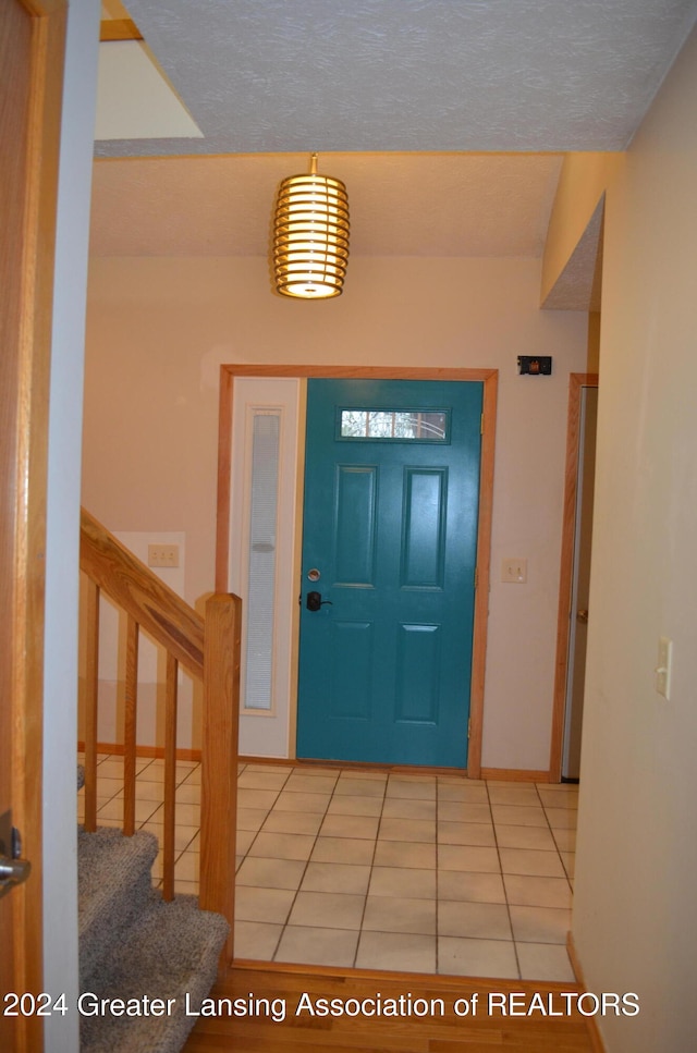 entrance foyer featuring tile patterned flooring