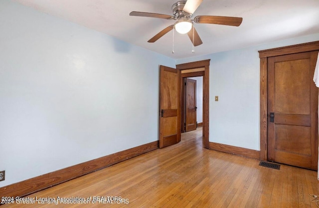 unfurnished bedroom featuring ceiling fan and light hardwood / wood-style floors