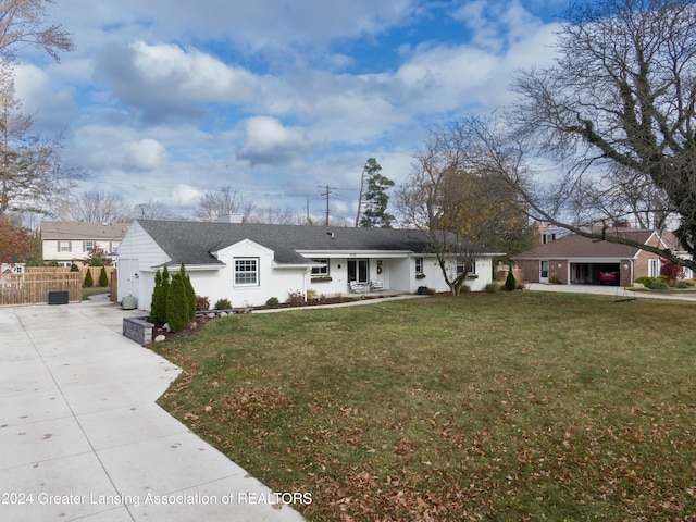 single story home with a front lawn