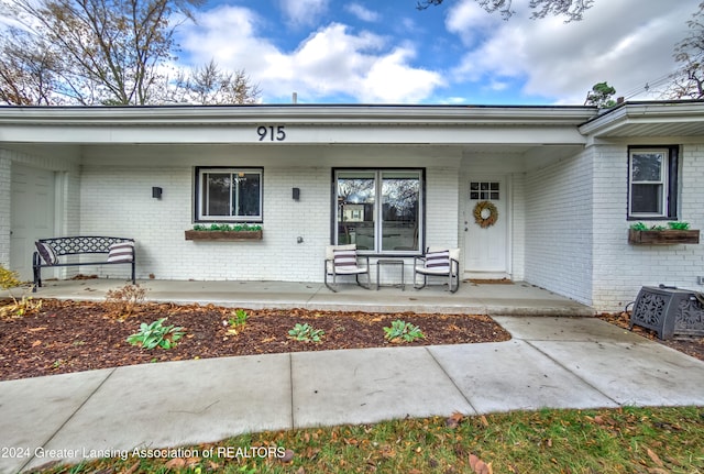 doorway to property with a porch