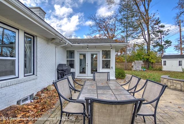 view of patio with french doors and a grill