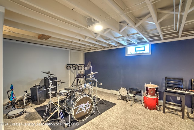 workout room featuring carpet flooring and baseboard heating