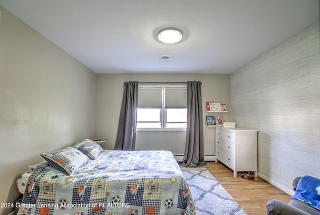 bedroom with light hardwood / wood-style floors