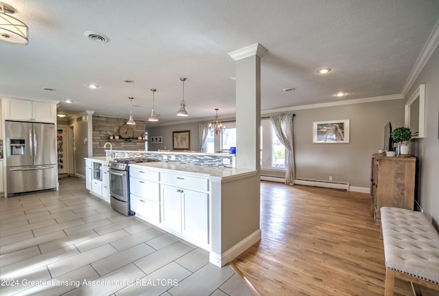 kitchen with white cabinetry, appliances with stainless steel finishes, decorative light fixtures, light wood-type flooring, and baseboard heating