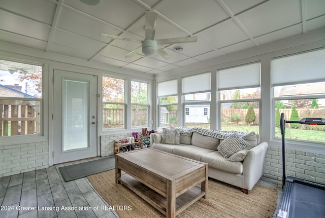 sunroom with a wealth of natural light and ceiling fan