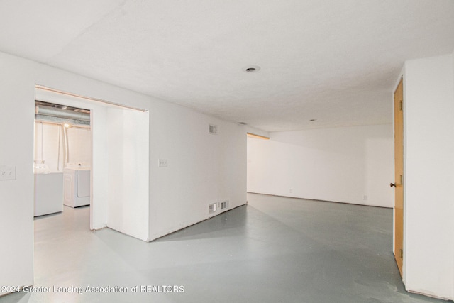 unfurnished room with concrete flooring