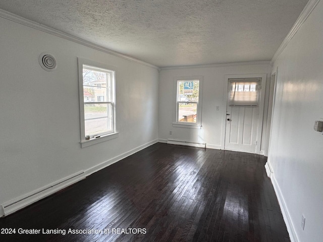 foyer with plenty of natural light, a textured ceiling, dark hardwood / wood-style floors, and a baseboard radiator