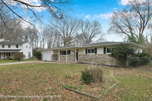 view of front facade featuring a front lawn, a porch, and a garage