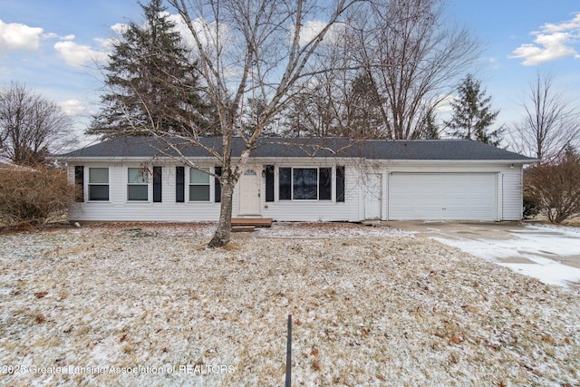 ranch-style house with concrete driveway and an attached garage