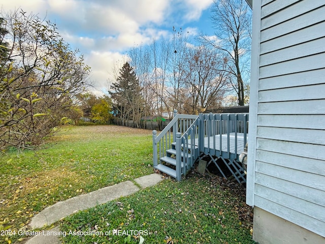 view of yard with a wooden deck