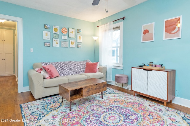 living room with ceiling fan and light hardwood / wood-style floors