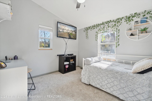 carpeted bedroom featuring ceiling fan and vaulted ceiling