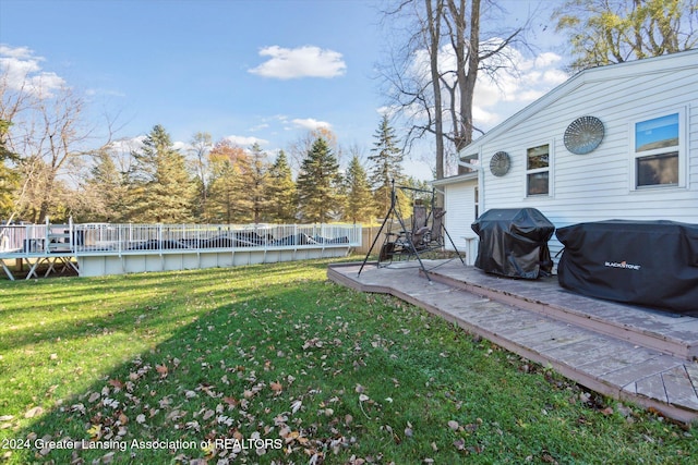 view of yard featuring a pool side deck