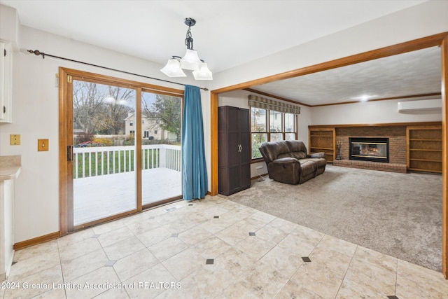 unfurnished living room with light carpet, a notable chandelier, and a brick fireplace