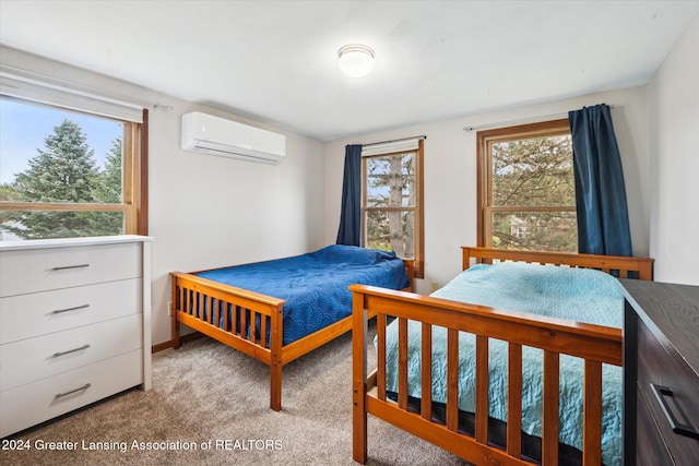 carpeted bedroom featuring a wall mounted air conditioner