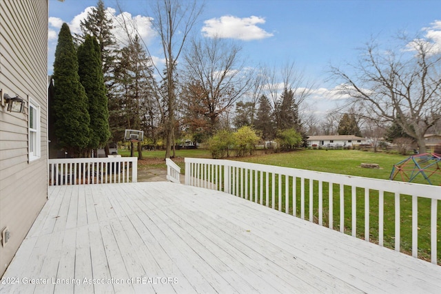 wooden deck with a lawn