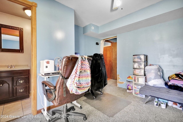 carpeted office space featuring sink