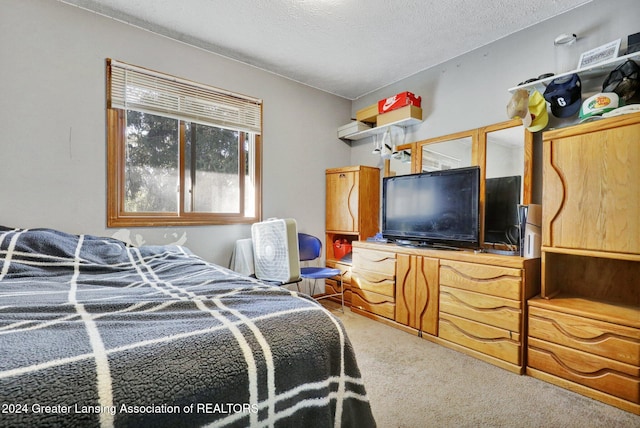 carpeted bedroom with a textured ceiling