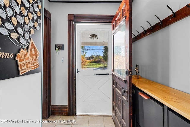 doorway to outside featuring light tile patterned floors