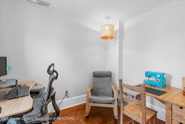 office space featuring hardwood / wood-style floors and a textured ceiling