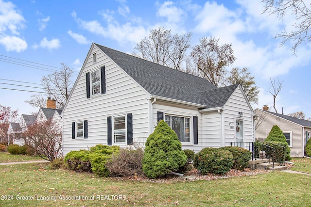 view of side of home featuring a yard