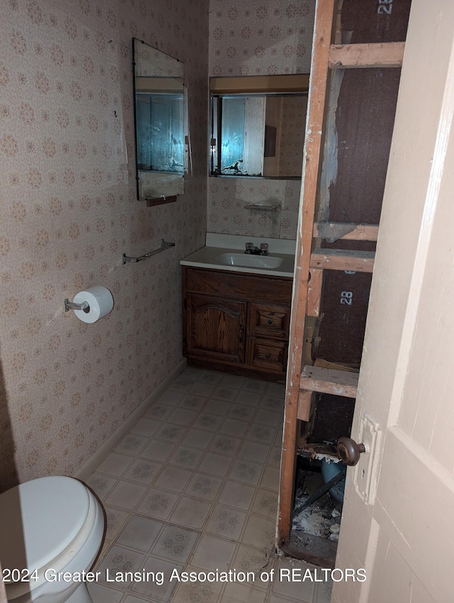 bathroom with vanity and toilet