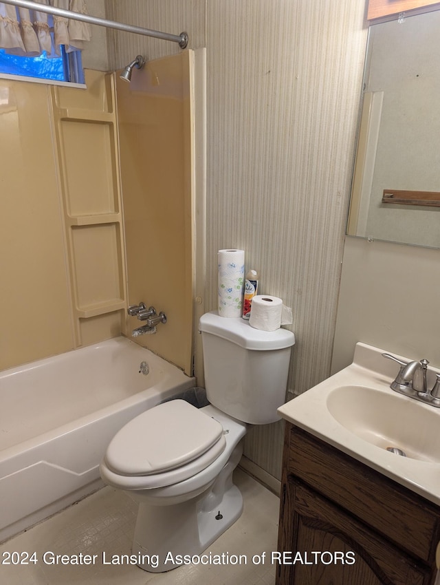 full bathroom featuring shower / bathing tub combination, vanity, and toilet