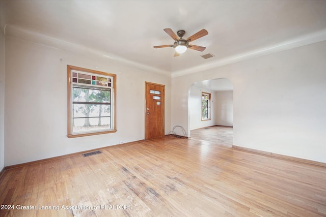 spare room featuring ceiling fan and light hardwood / wood-style flooring