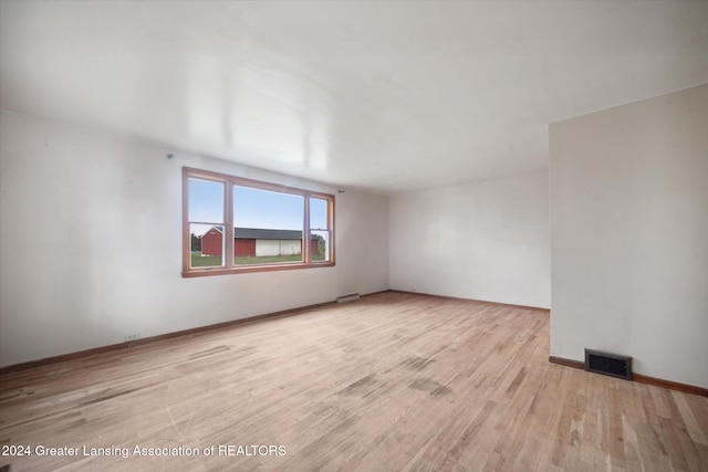 spare room featuring light hardwood / wood-style flooring