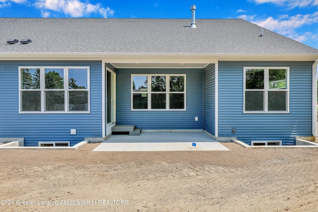 rear view of house featuring a patio