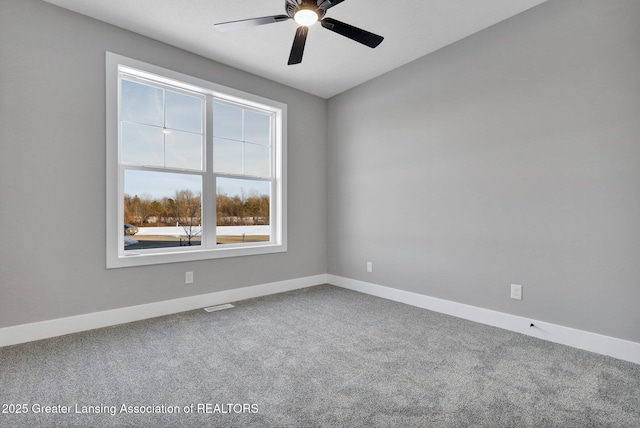 carpeted empty room with ceiling fan