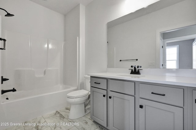 full bathroom featuring vanity, tub / shower combination, and toilet