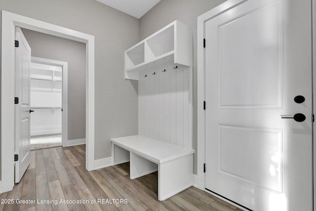 mudroom with light hardwood / wood-style floors