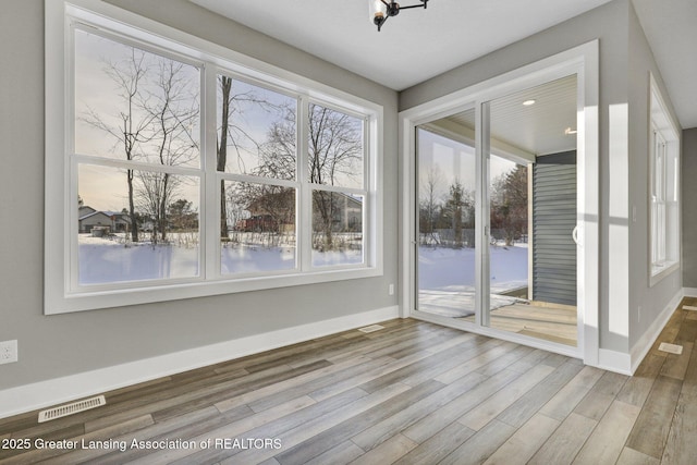 interior space featuring hardwood / wood-style flooring and a water view