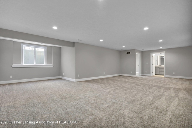 empty room featuring light colored carpet