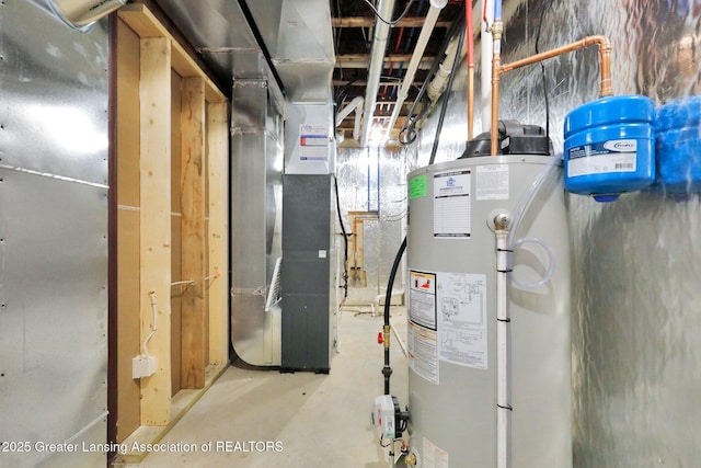 utility room featuring heating unit and gas water heater