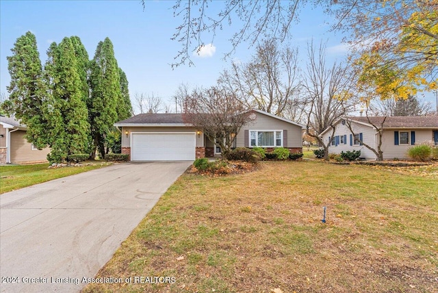 single story home with a front yard and a garage