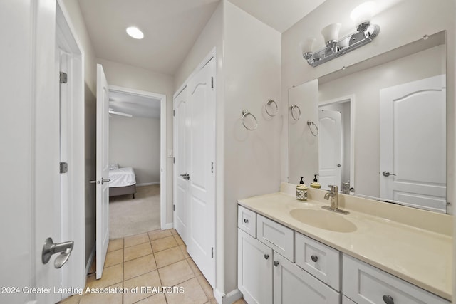 bathroom featuring tile patterned flooring and vanity