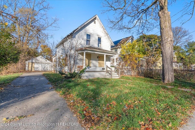 view of front of property featuring covered porch and a front yard