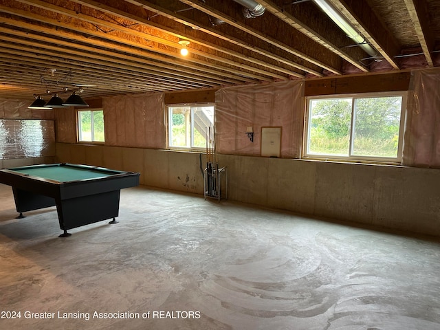 playroom featuring a wealth of natural light, concrete floors, and billiards