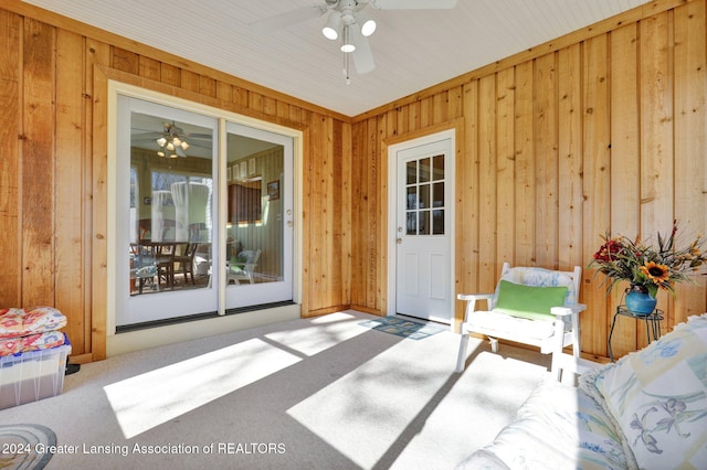 view of exterior entry featuring ceiling fan