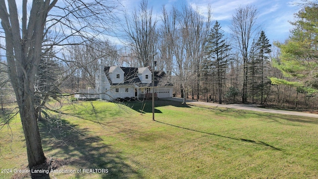 view of yard featuring a garage