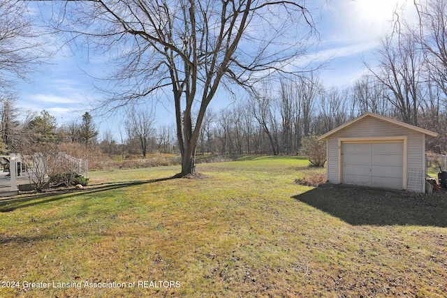 view of yard with an outdoor structure and a garage