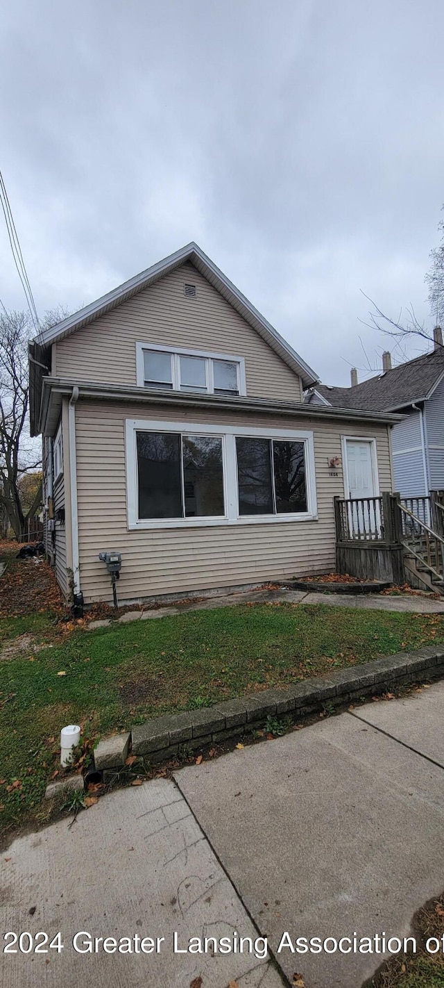 view of side of home featuring a yard