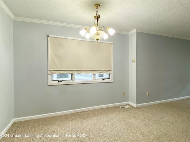 empty room featuring carpet, crown molding, a textured ceiling, and a chandelier